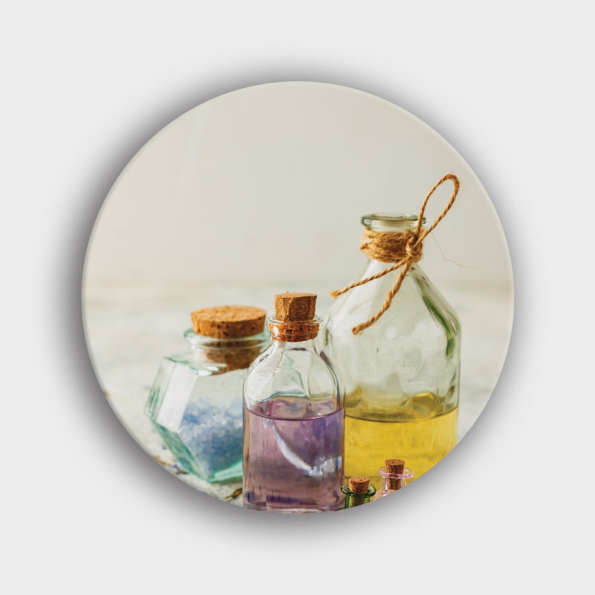 Muurcirkel "Verschillende aromaolies in kleine flesjes" | Wandcirkel